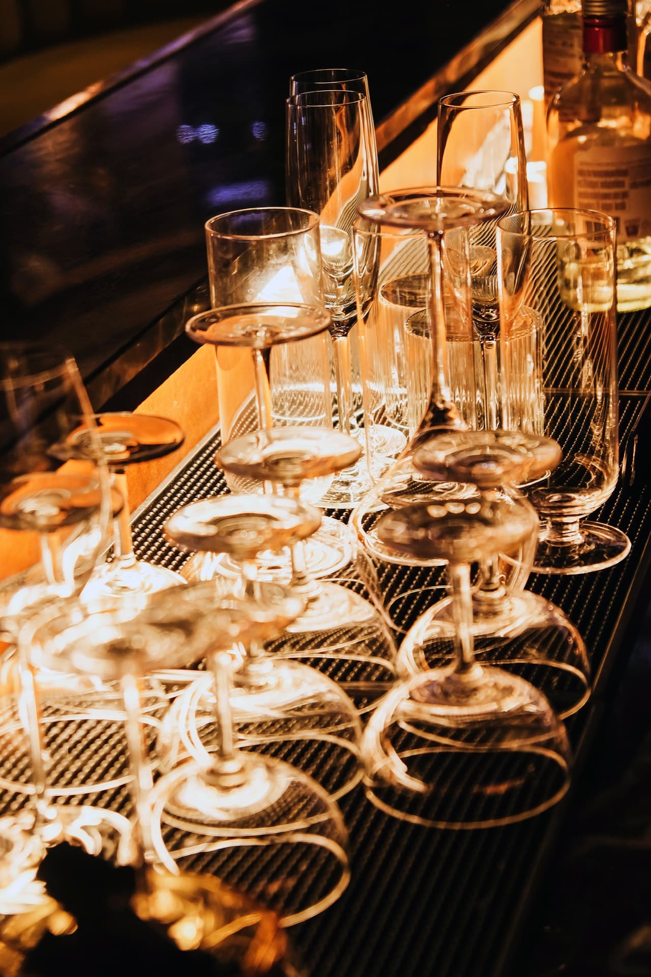 Glassware lined up on the bar — book your party at Bullfrog